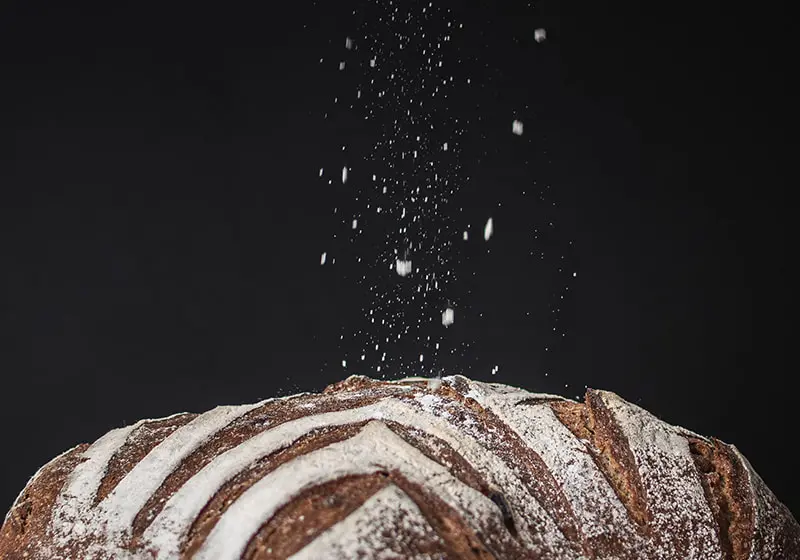 falling flour on bread